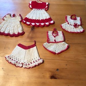 Red and white crocheted doll clothes and pot holder